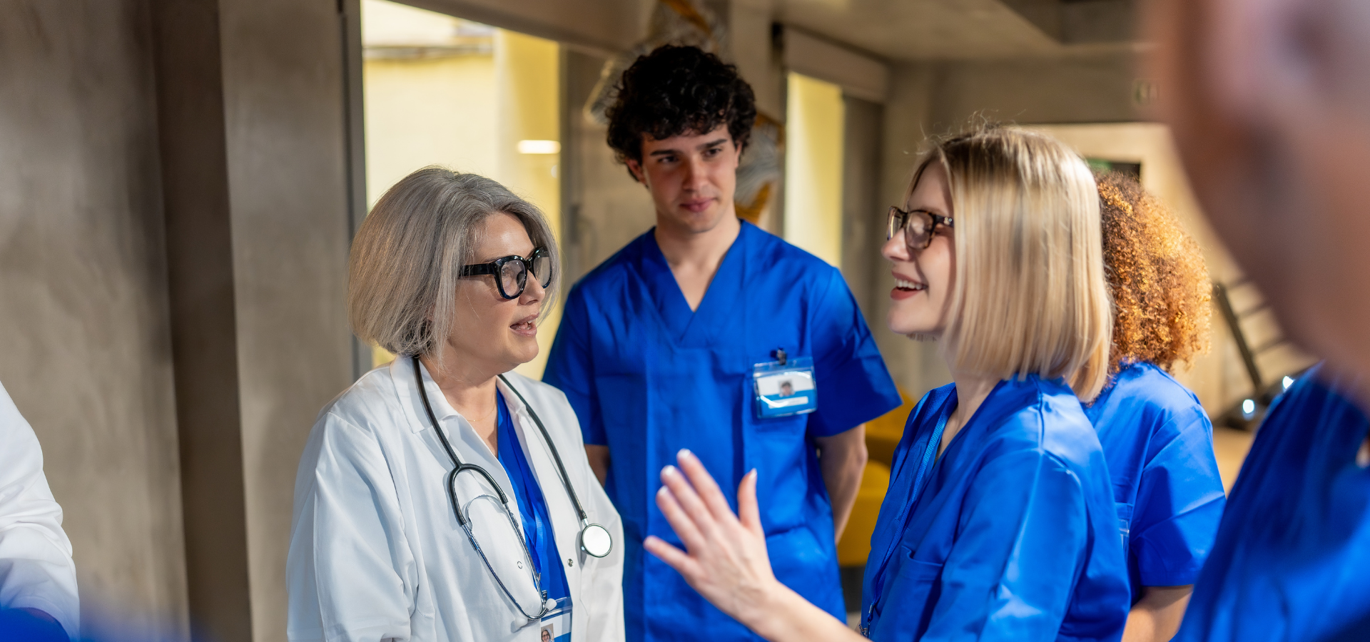 Experienced healthcare professional mentoring a team of technicians